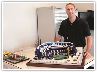 Jason Burik, assistant to the superintendent of Montour School District, with a model of PNC Park he was commissioned to create in 2001 by the Pittsburgh Pirates organization. Photo by Doug Hughey  LEGO